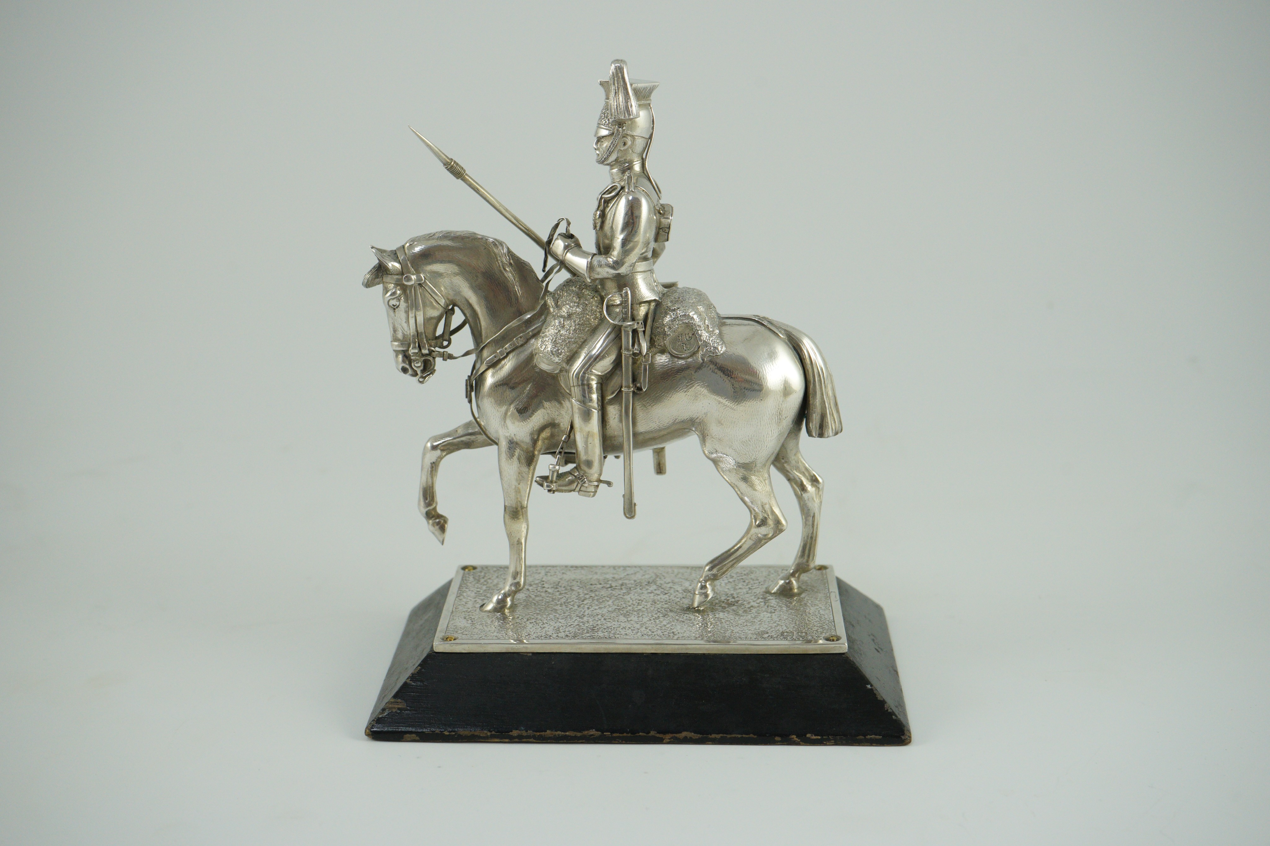 An early 20th century miniature model of a Royal Lancer on horseback, by The Goldsmiths and Silversmiths Co Ltd